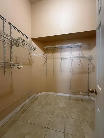 a bathroom with a mirror and a shower