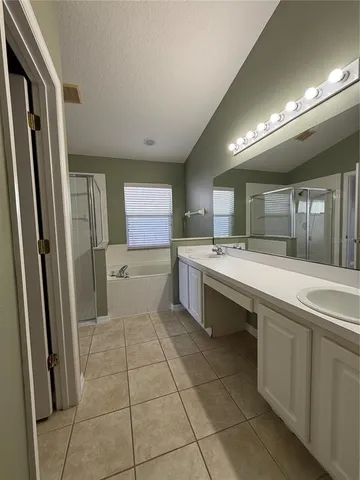 a kitchen with stainless steel appliances a refrigerator sink and stove