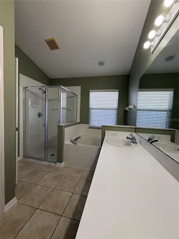 a large kitchen with cabinets and stainless steel appliances