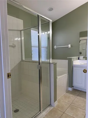 a kitchen with a refrigerator a sink and cabinets