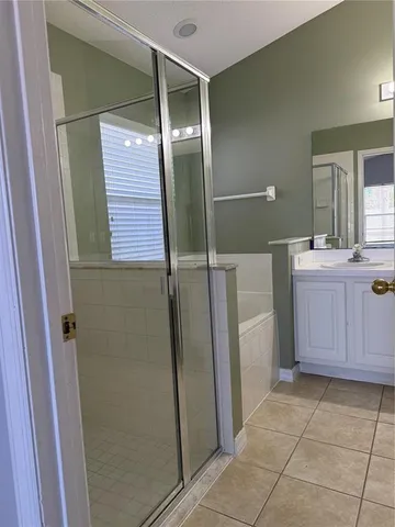 a view of a livingroom with a ceiling fan and window