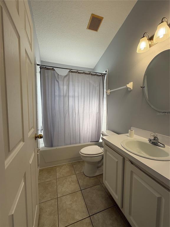 436 Saddle Ridge Drive Davenport, FL 33896 - Photo 6 of 35 a bathroom with a sink a toilet and shower