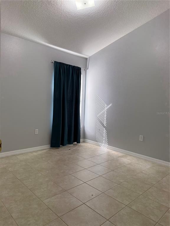 436 Saddle Ridge Drive Davenport, FL 33896 - Photo 8 of 35 a view of an empty room with wooden floor