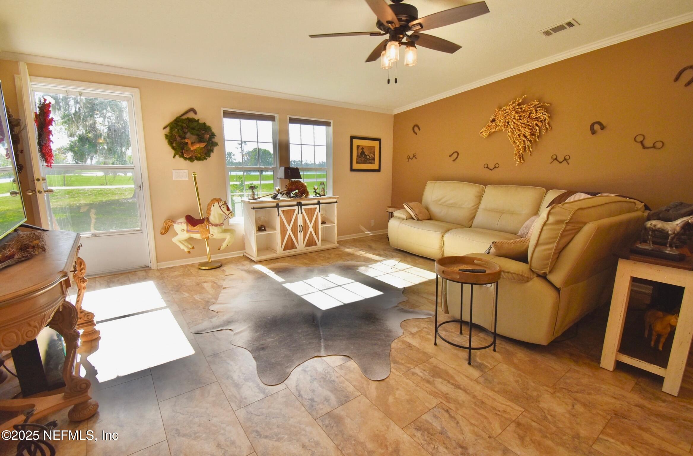 500 Georgetown Shortcut Road Georgetown, FL 32139 - Photo 23 of 59 a living room with furniture and a large window