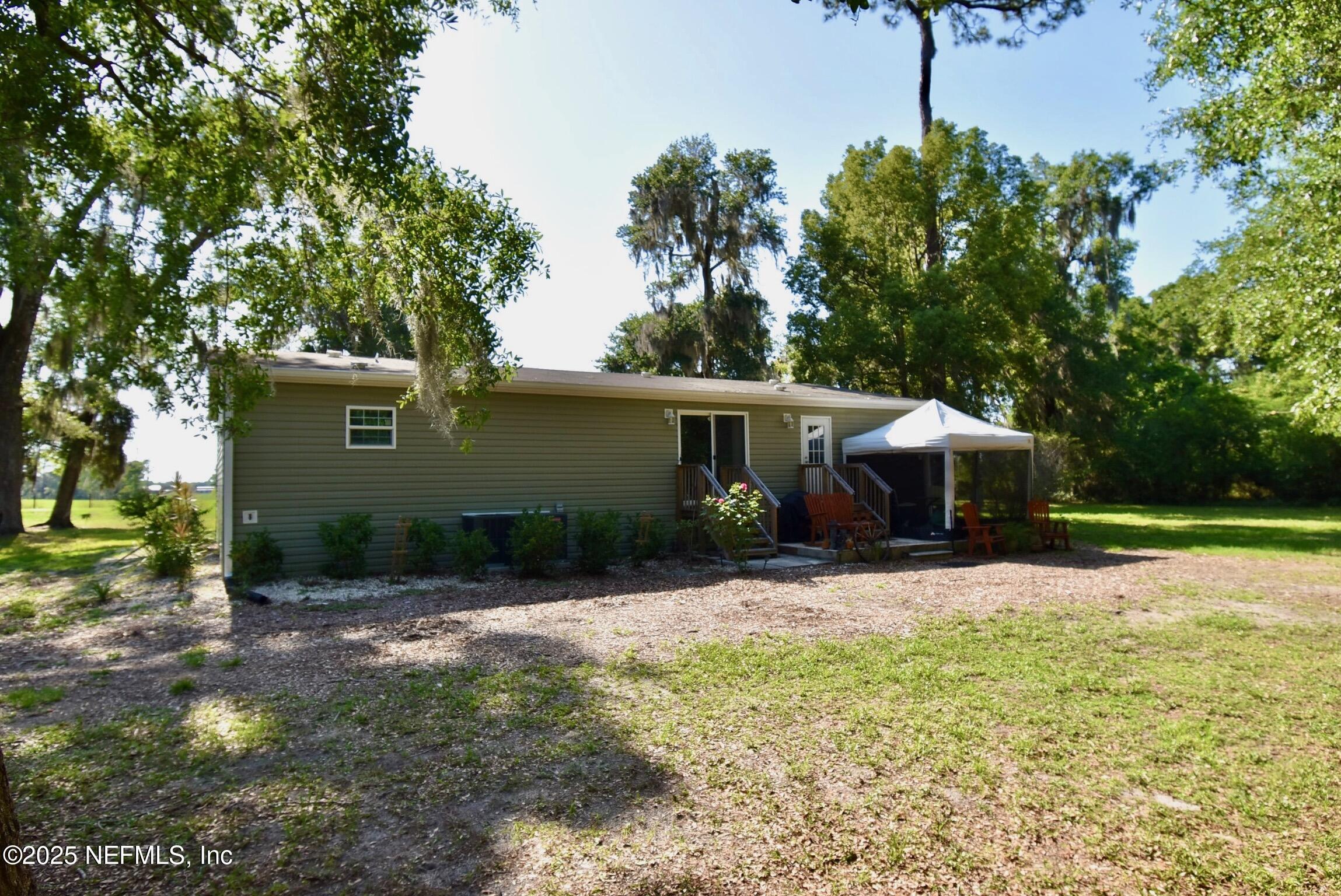 500 Georgetown Shortcut Road Georgetown, FL 32139 - Photo 3 of 59 a front view of a house with garden