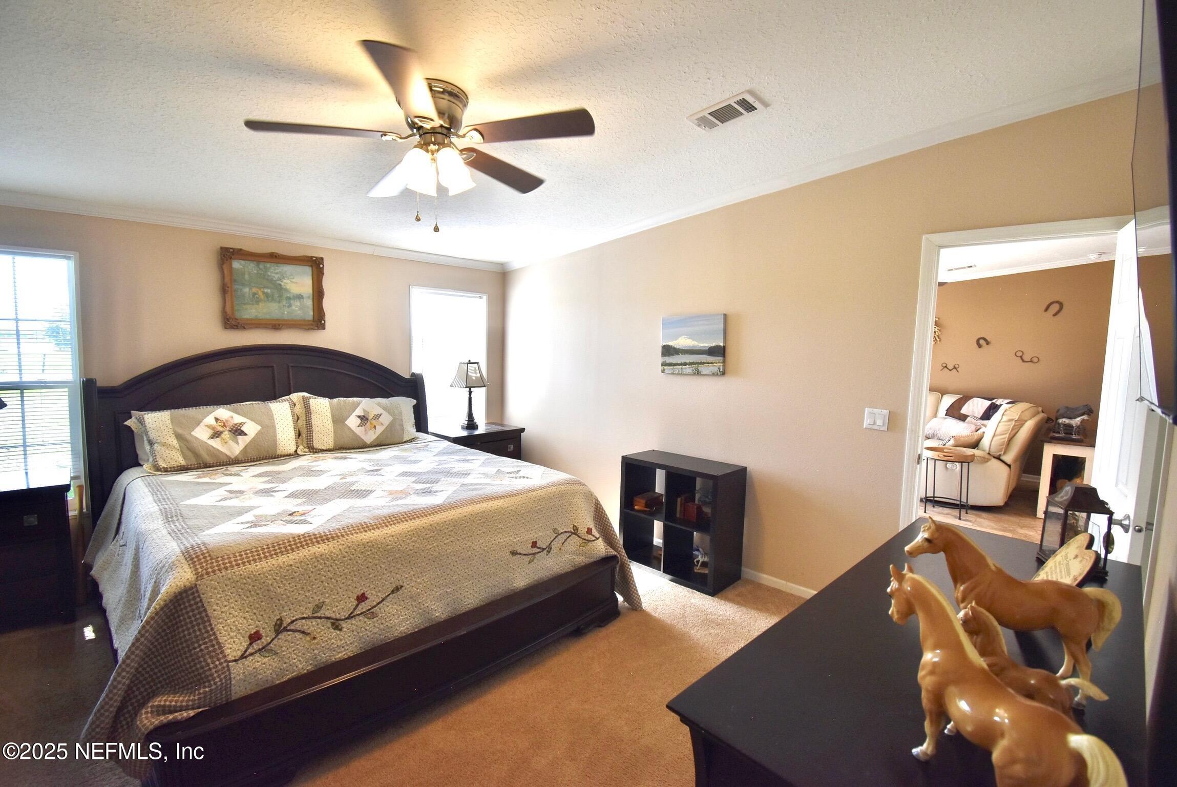 500 Georgetown Shortcut Road Georgetown, FL 32139 - Photo 34 of 59 a bedroom with a bed and window