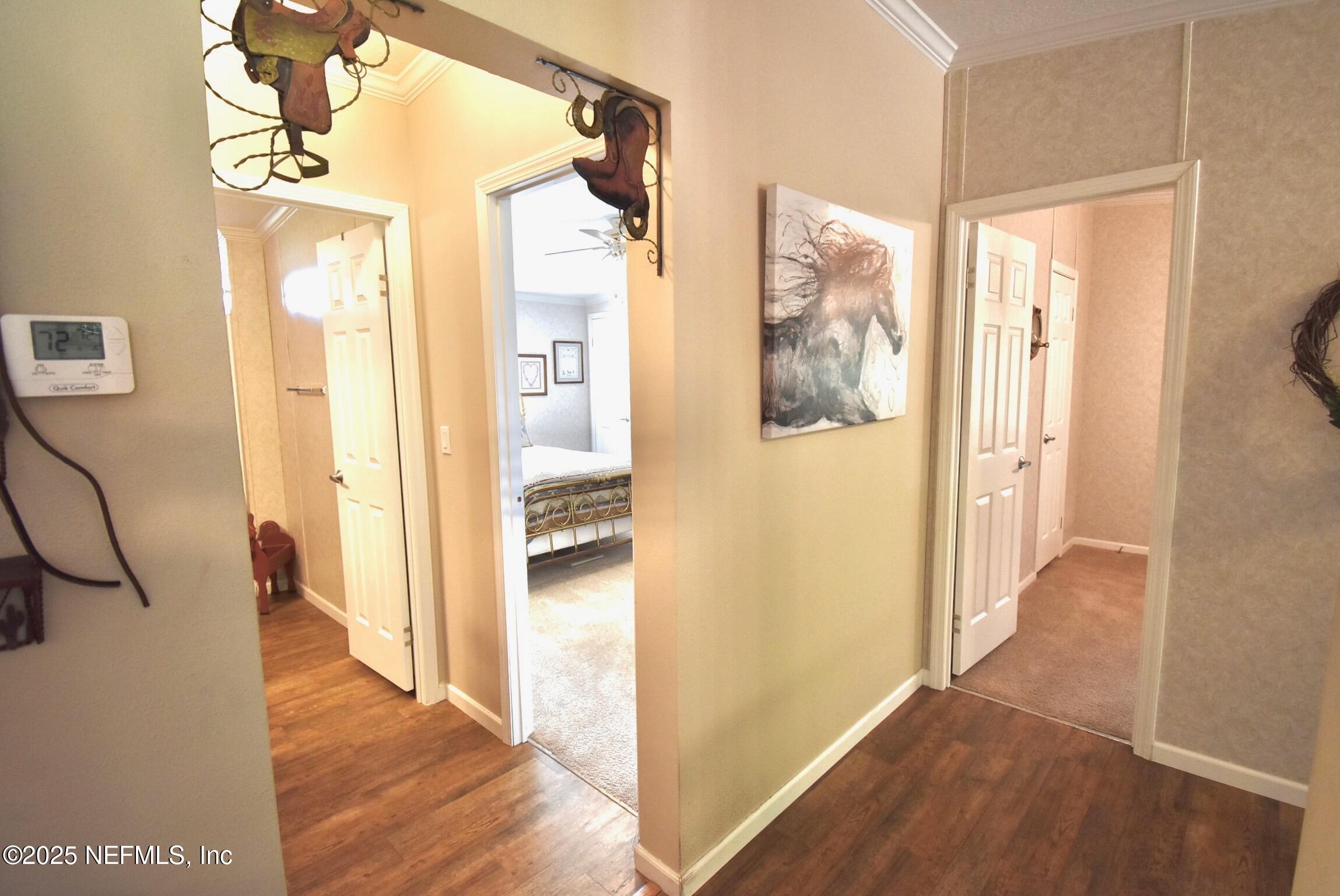 500 Georgetown Shortcut Road Georgetown, FL 32139 - Photo 40 of 59 a view of a hallway with wooden floor and door
