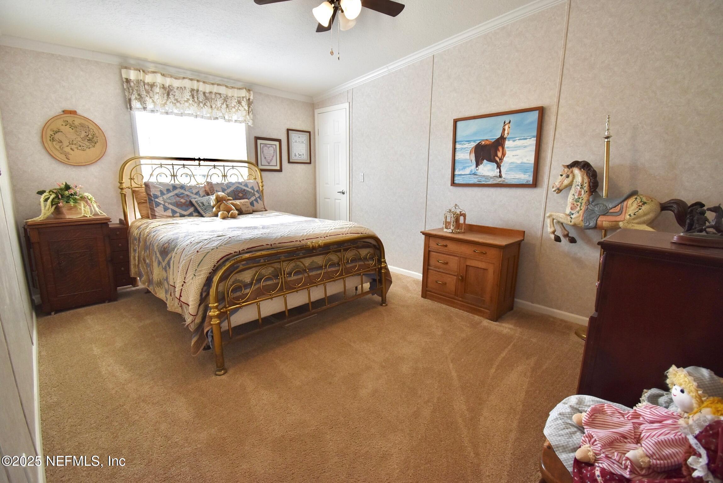 500 Georgetown Shortcut Road Georgetown, FL 32139 - Photo 41 of 59 a bedroom with a bed and dresser