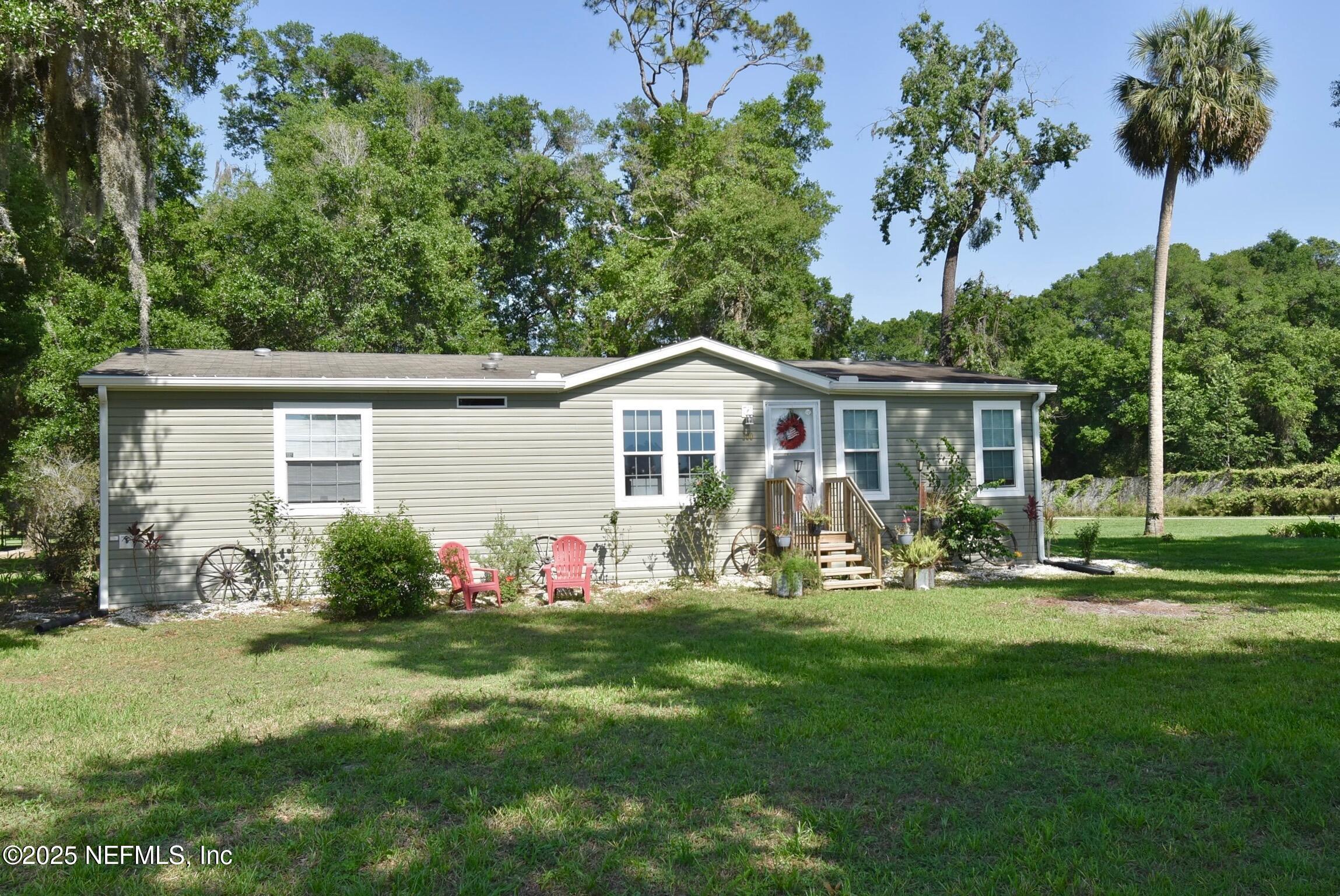 500 Georgetown Shortcut Road Georgetown, FL 32139 - Photo 51 of 59 a front view of house with yard outdoor seating and green space