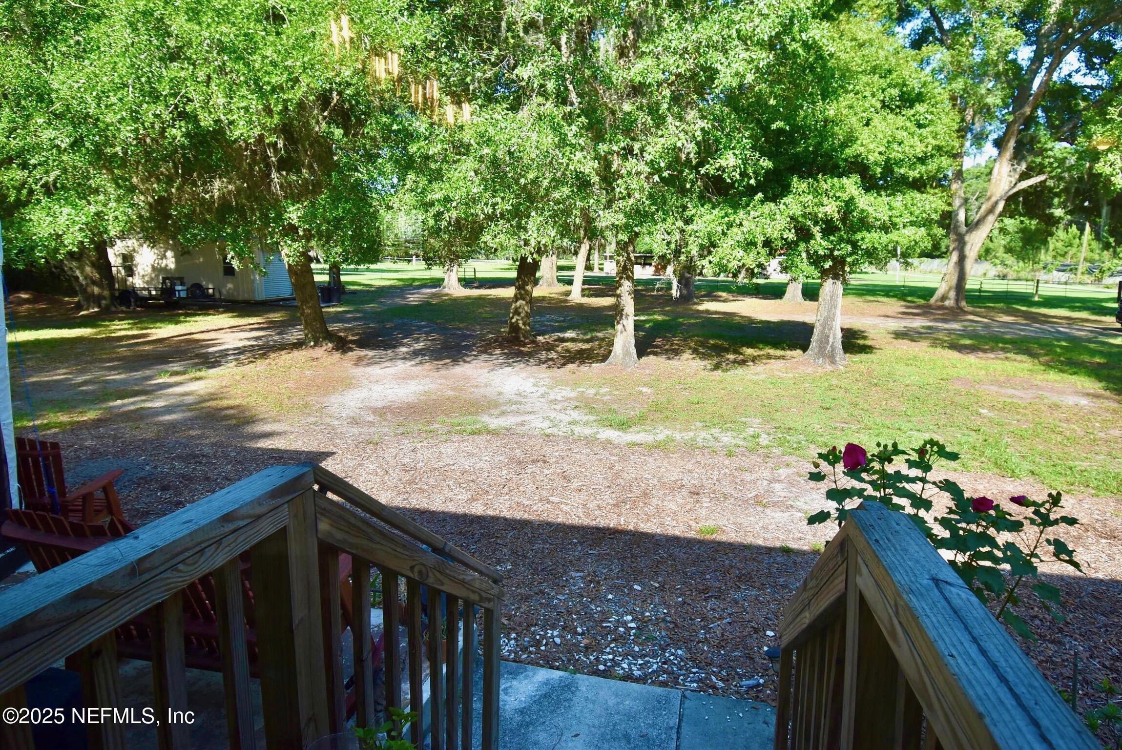 500 Georgetown Shortcut Road Georgetown, FL 32139 - Photo 8 of 59 a view of a backyard with wooden fence