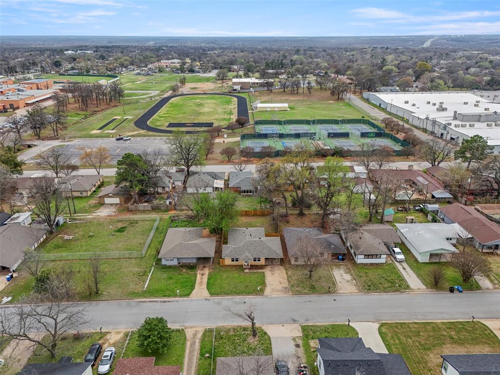 732 Bullock Street Denison, TX 75020 - Photo 24 of 29 an aerial view of residential houses with outdoor space and swimming pool