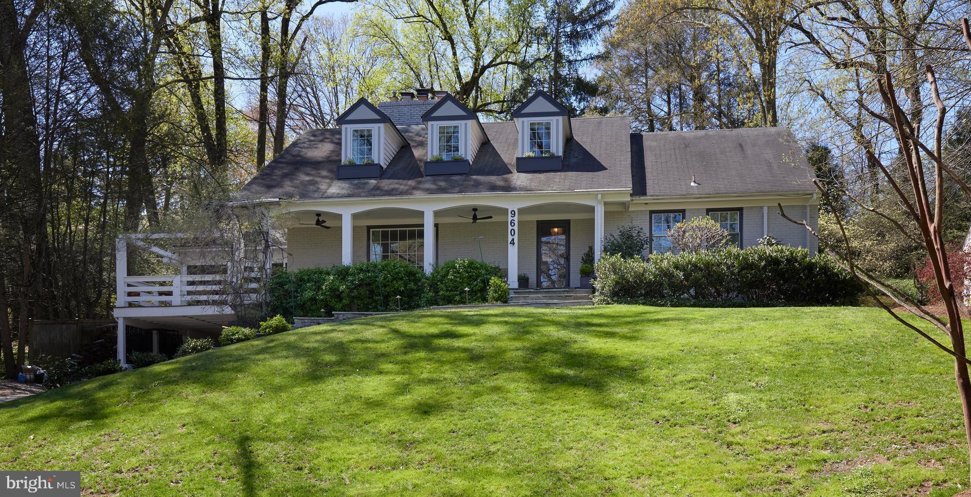 a house that has a tree in front of it