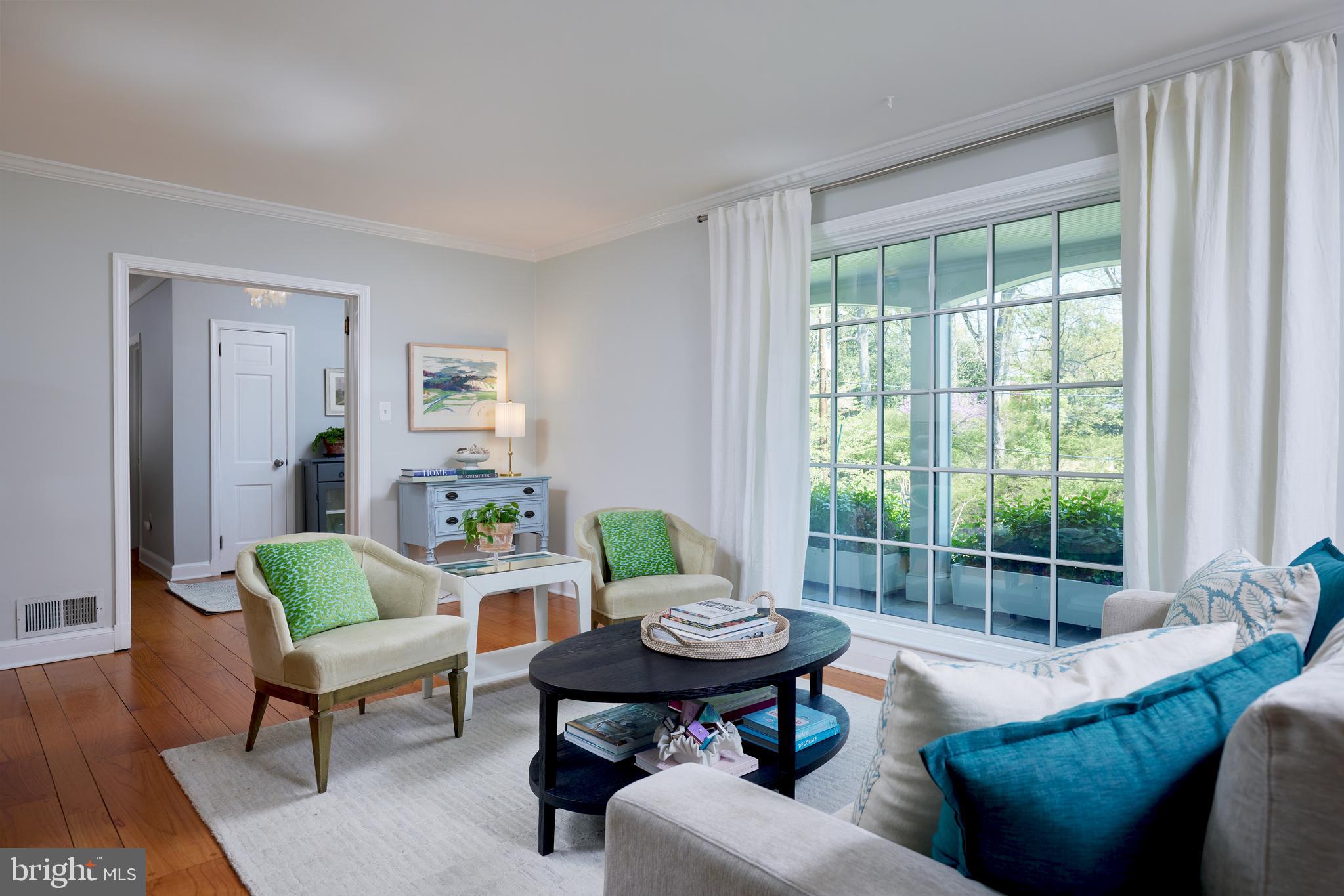 9604 Old Spring Road Kensington, MD 20895 - Photo 11 of 80 a living room with furniture and a large window