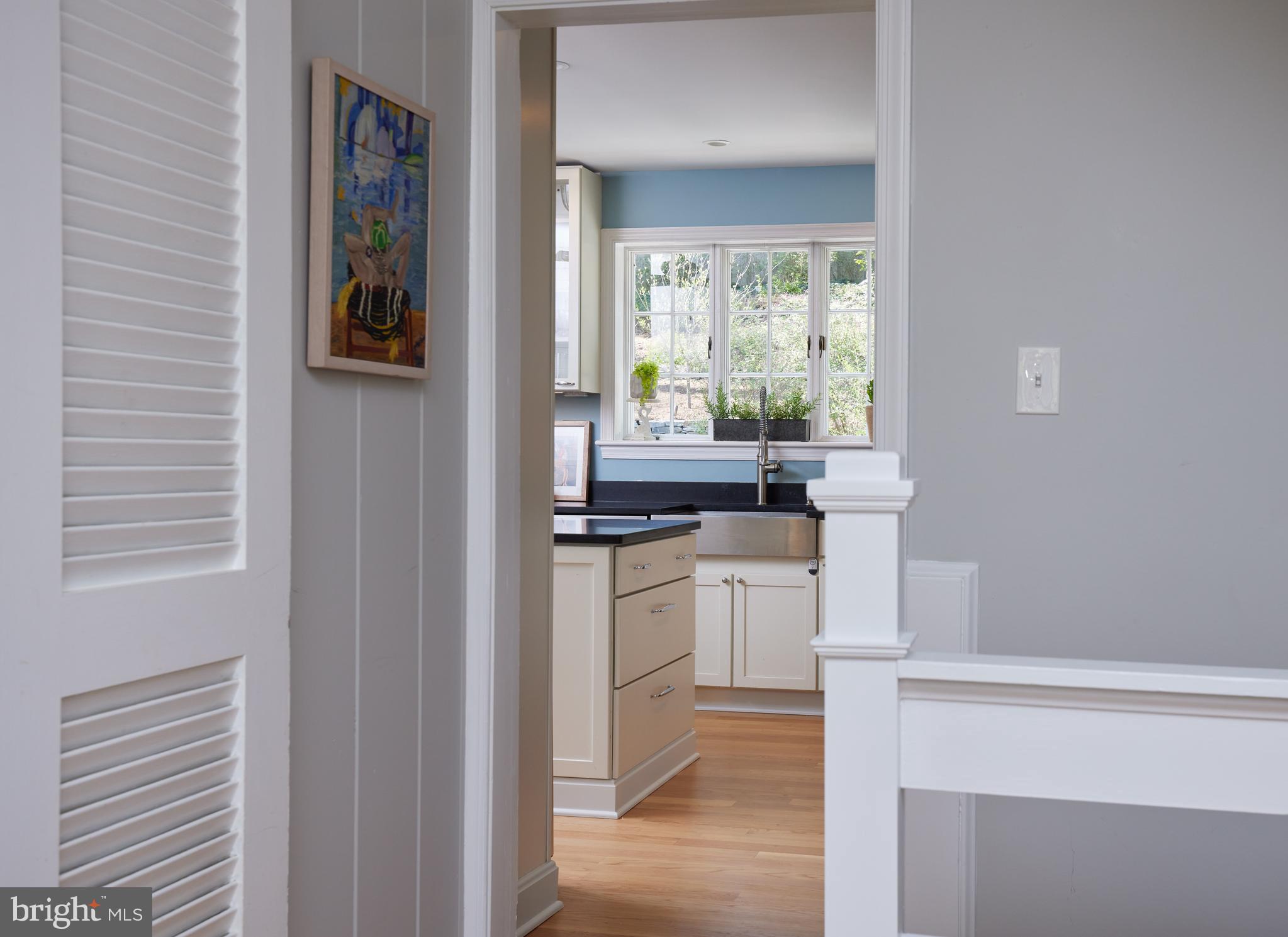 9604 Old Spring Road Kensington, MD 20895 - Photo 12 of 80 a kitchen with a sink and cabinets