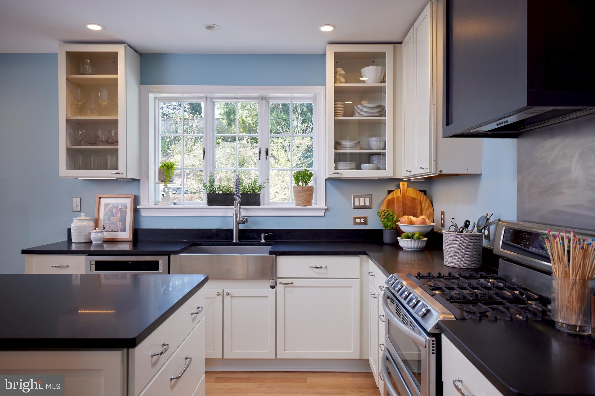 9604 Old Spring Road Kensington, MD 20895 - Photo 13 of 80 a kitchen with granite countertop a stove a sink and a granite counter tops