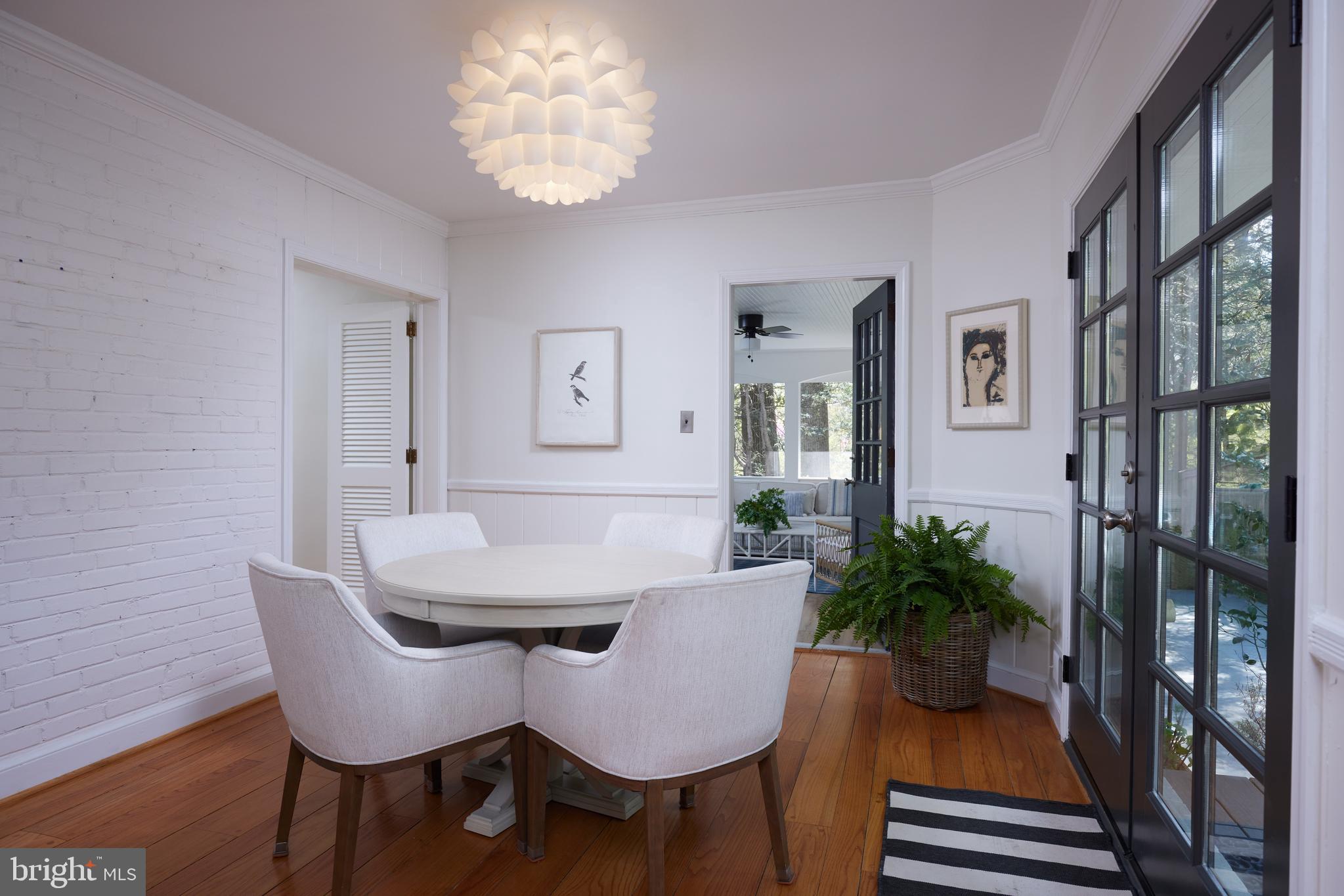 9604 Old Spring Road Kensington, MD 20895 - Photo 19 of 80 a view of a dining room with furniture and wooden floor