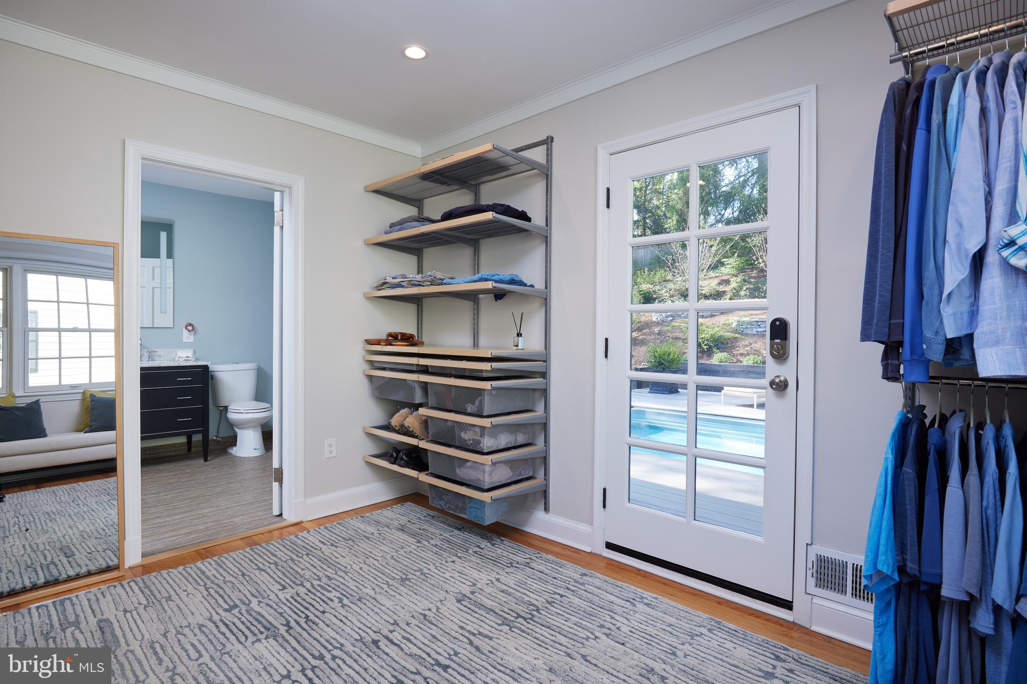9604 Old Spring Road Kensington, MD 20895 - Photo 27 of 80 a view of walk in closet with clothes and shoes