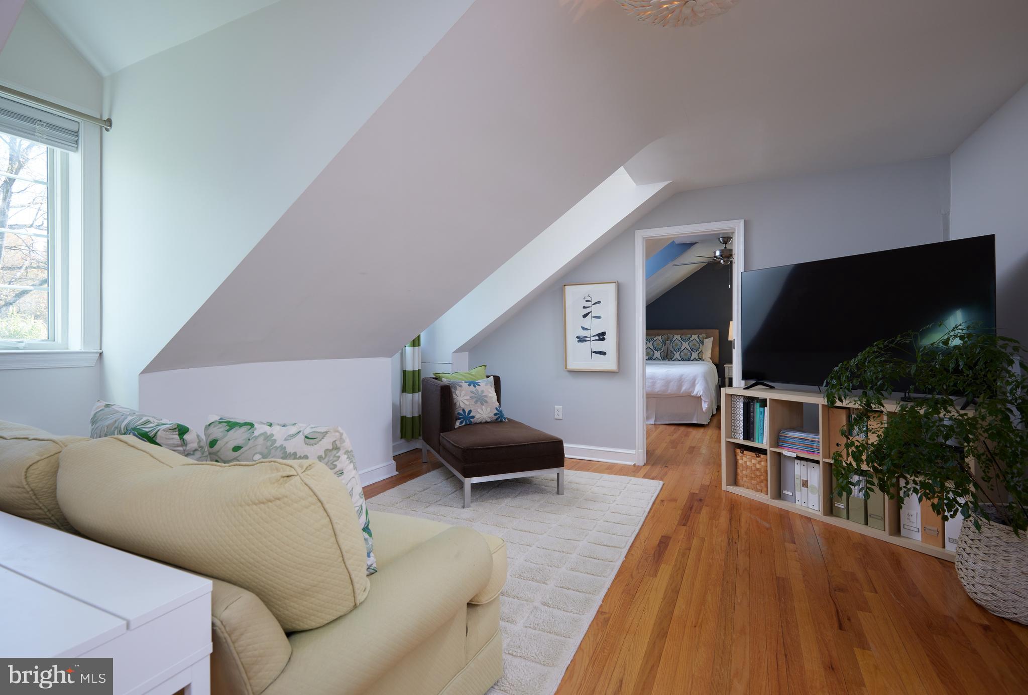 9604 Old Spring Road Kensington, MD 20895 - Photo 33 of 80 a living room with furniture and a flat screen tv