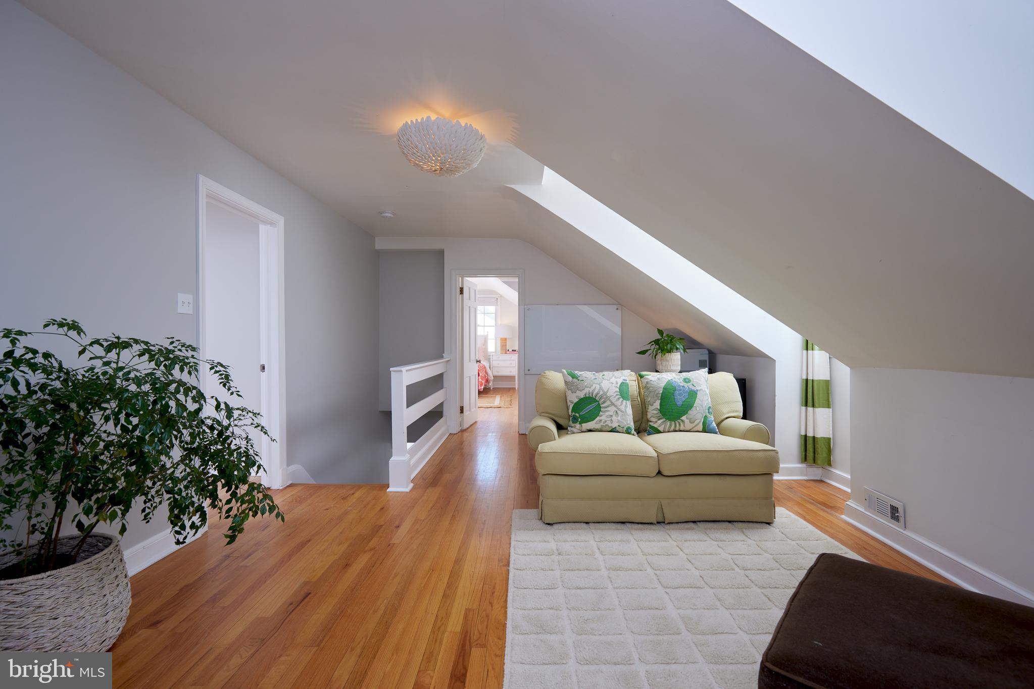 9604 Old Spring Road Kensington, MD 20895 - Photo 34 of 80 a living room with furniture and a potted plant