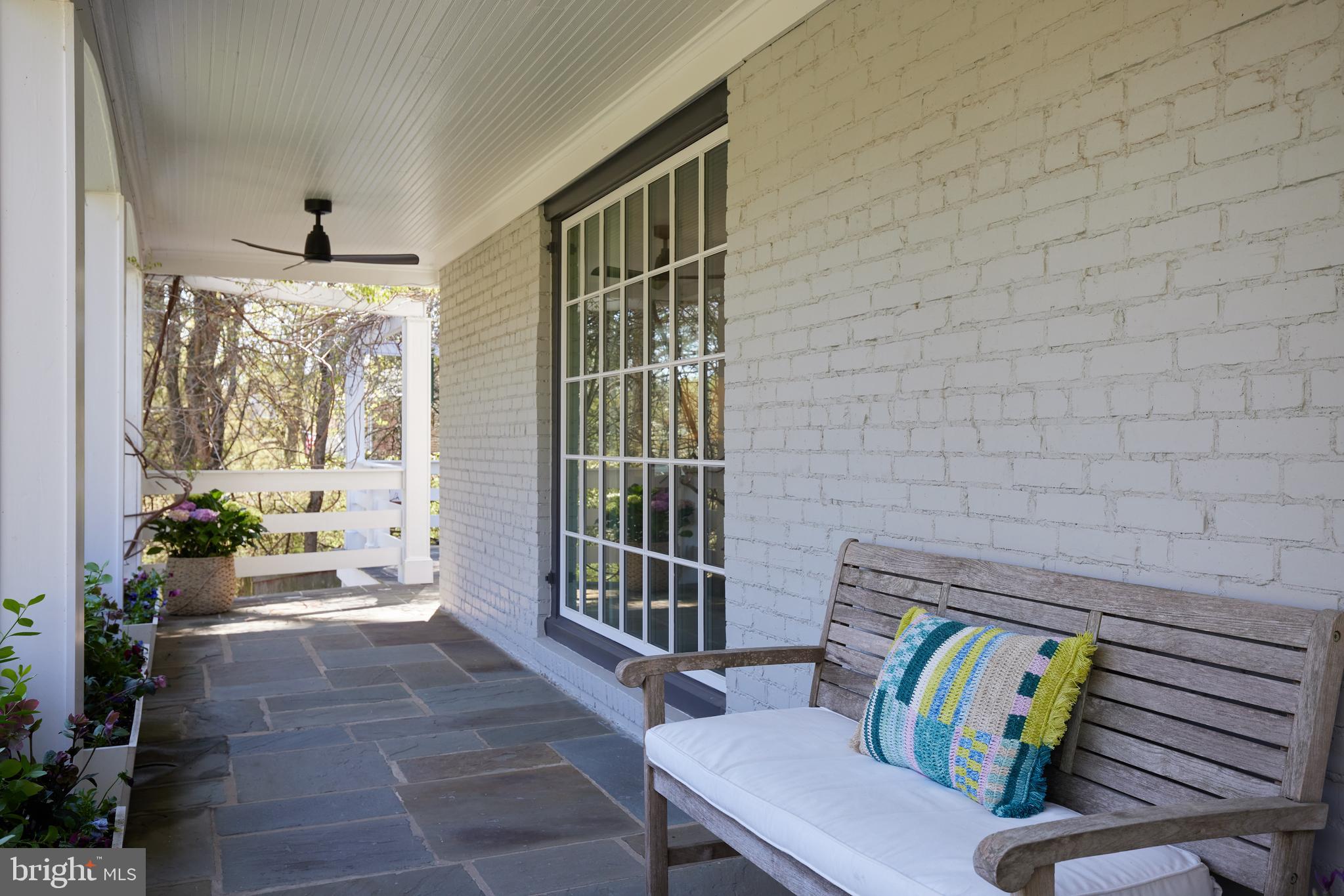 9604 Old Spring Road Kensington, MD 20895 - Photo 4 of 80 a living room with furniture and a floor to ceiling window