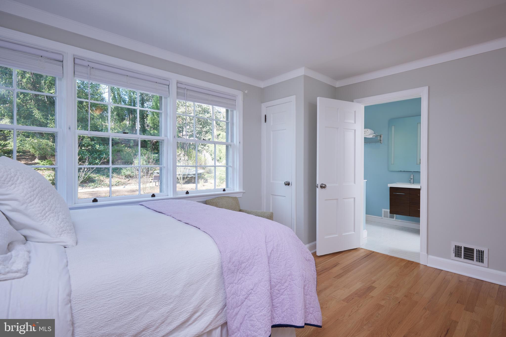 9604 Old Spring Road Kensington, MD 20895 - Photo 41 of 80 a bedroom with a bed and a large window