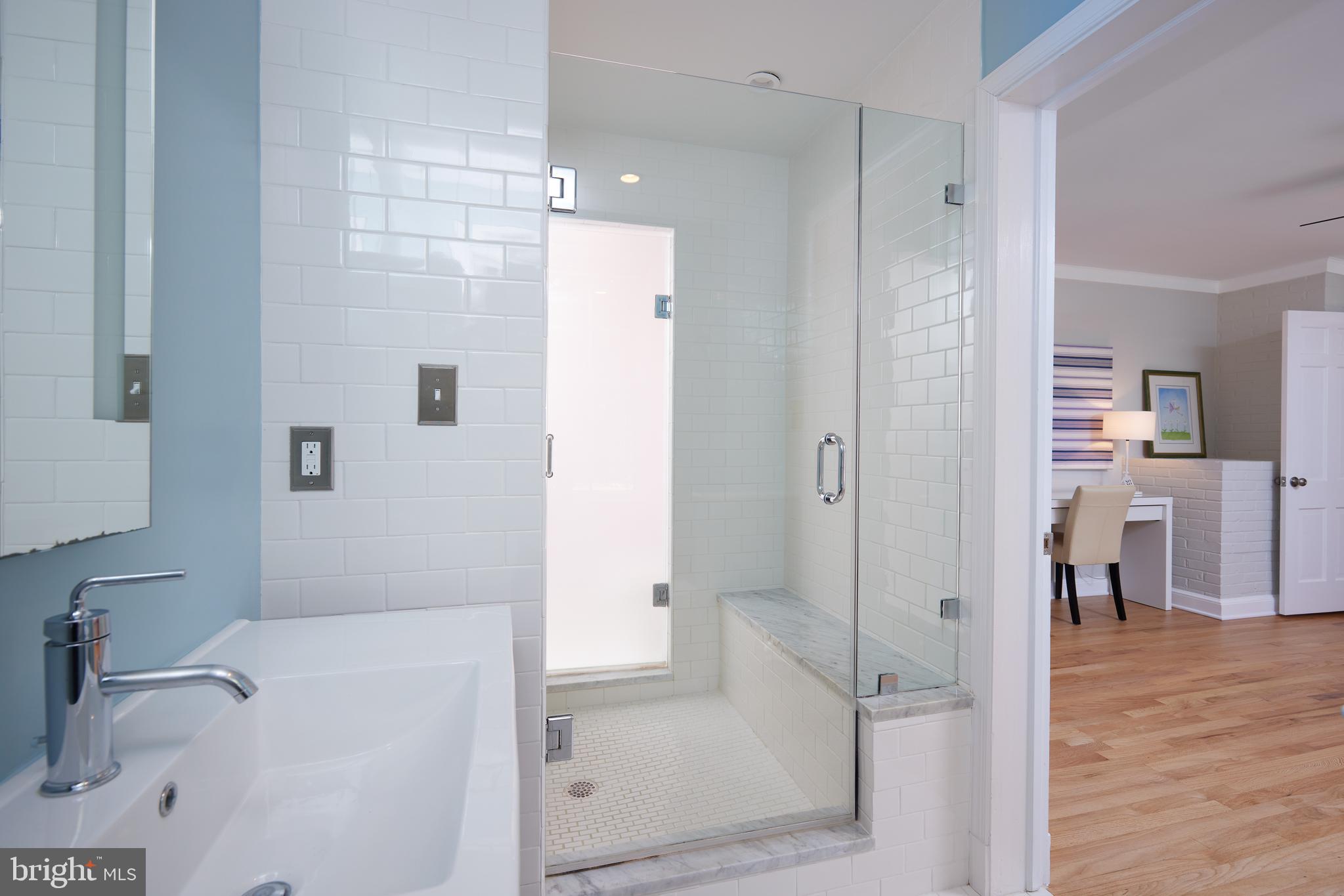 9604 Old Spring Road Kensington, MD 20895 - Photo 42 of 80 a bathroom with a tub and shower