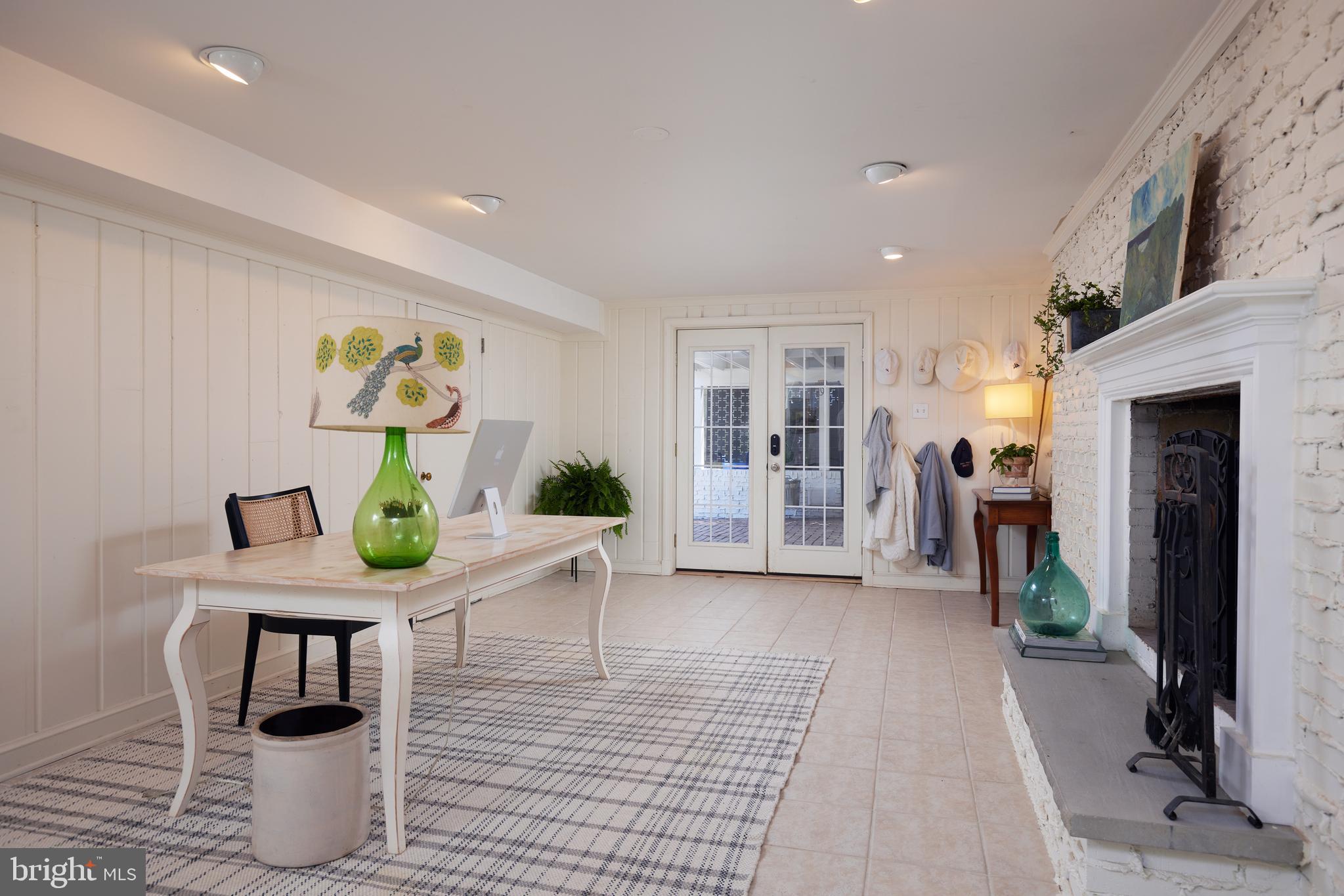 9604 Old Spring Road Kensington, MD 20895 - Photo 49 of 80 a living room with furniture and a table