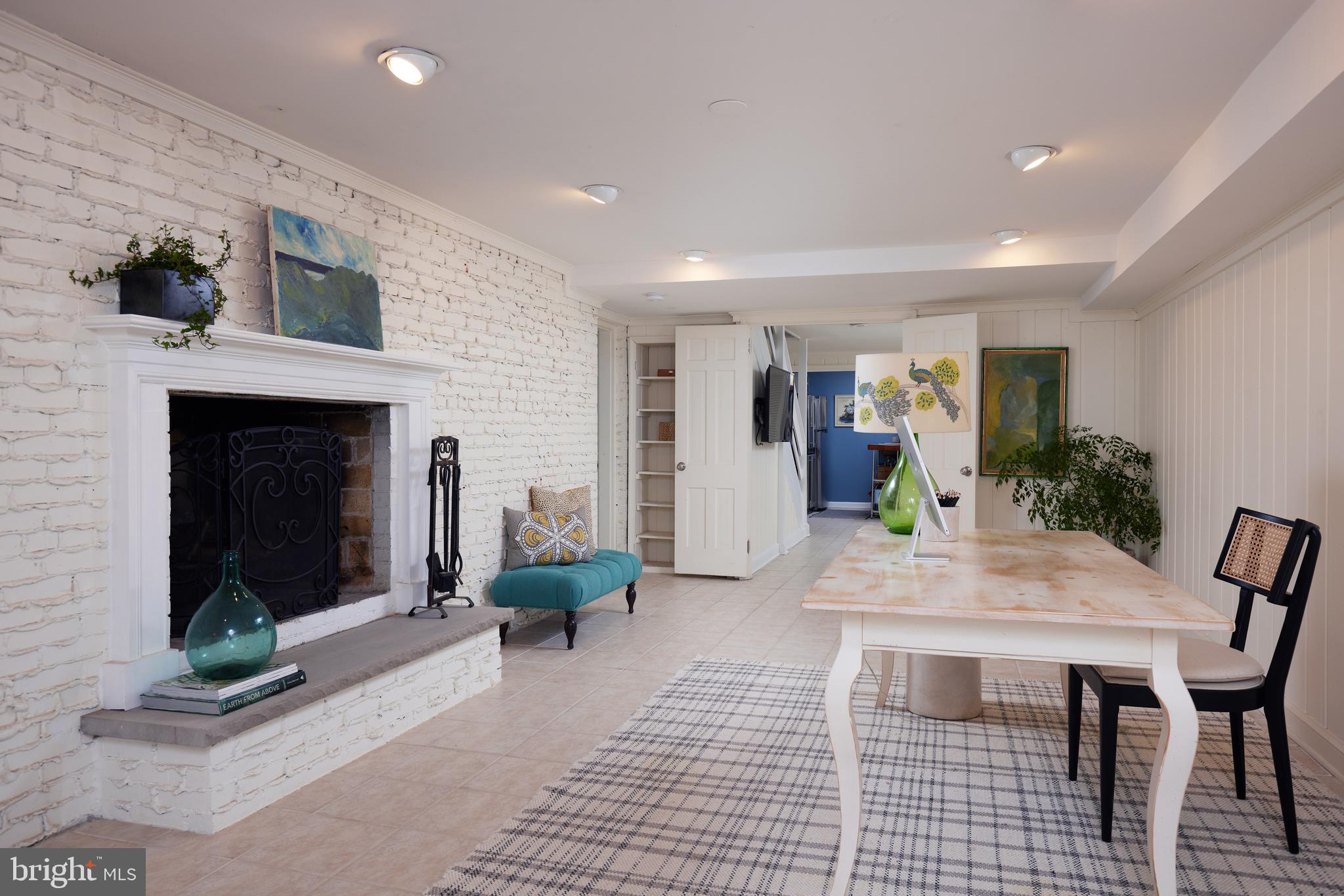 9604 Old Spring Road Kensington, MD 20895 - Photo 50 of 80 a view of a livingroom with furniture and a fireplace
