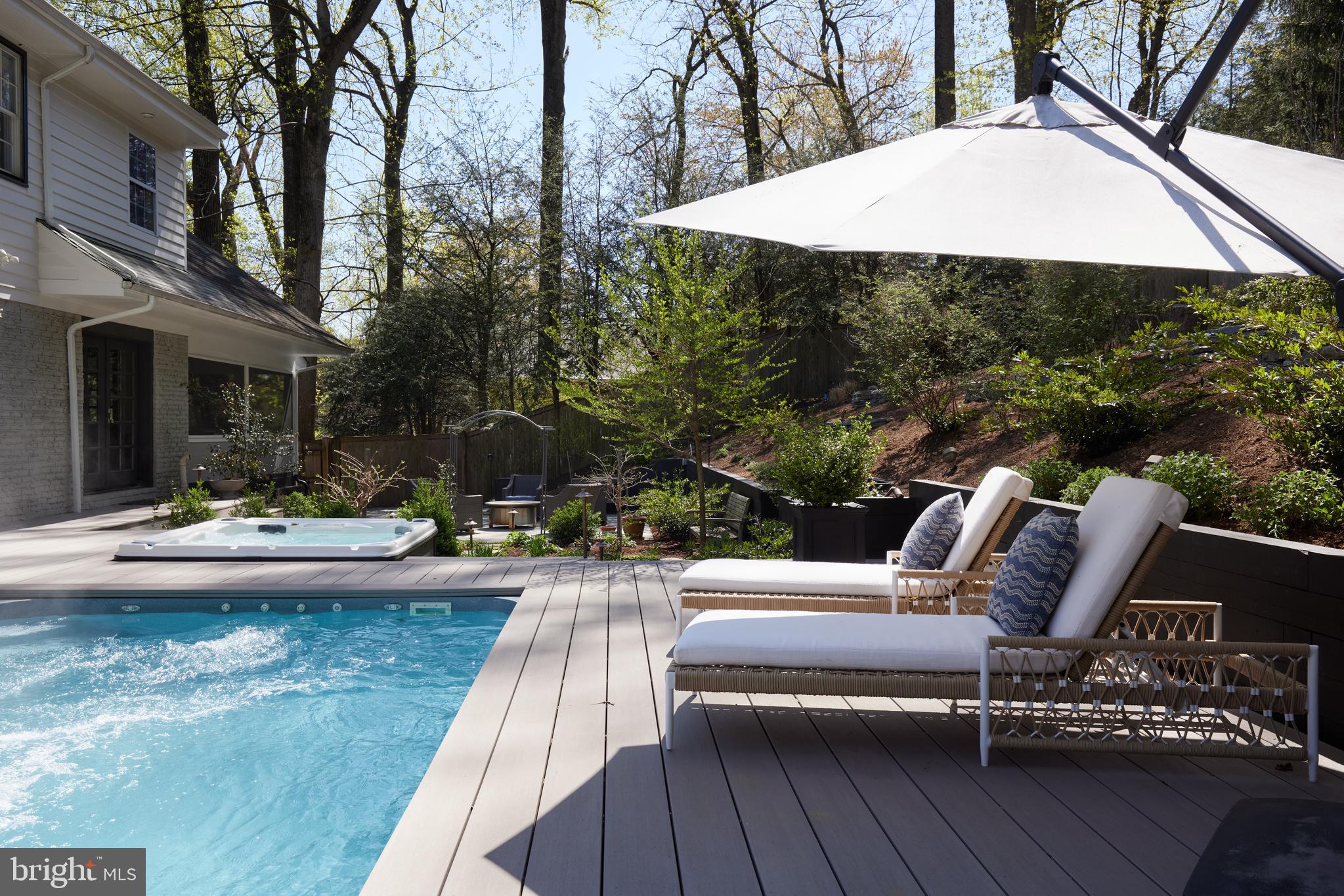 9604 Old Spring Road Kensington, MD 20895 - Photo 54 of 80 a view of swimming pool with outdoor seating and plants