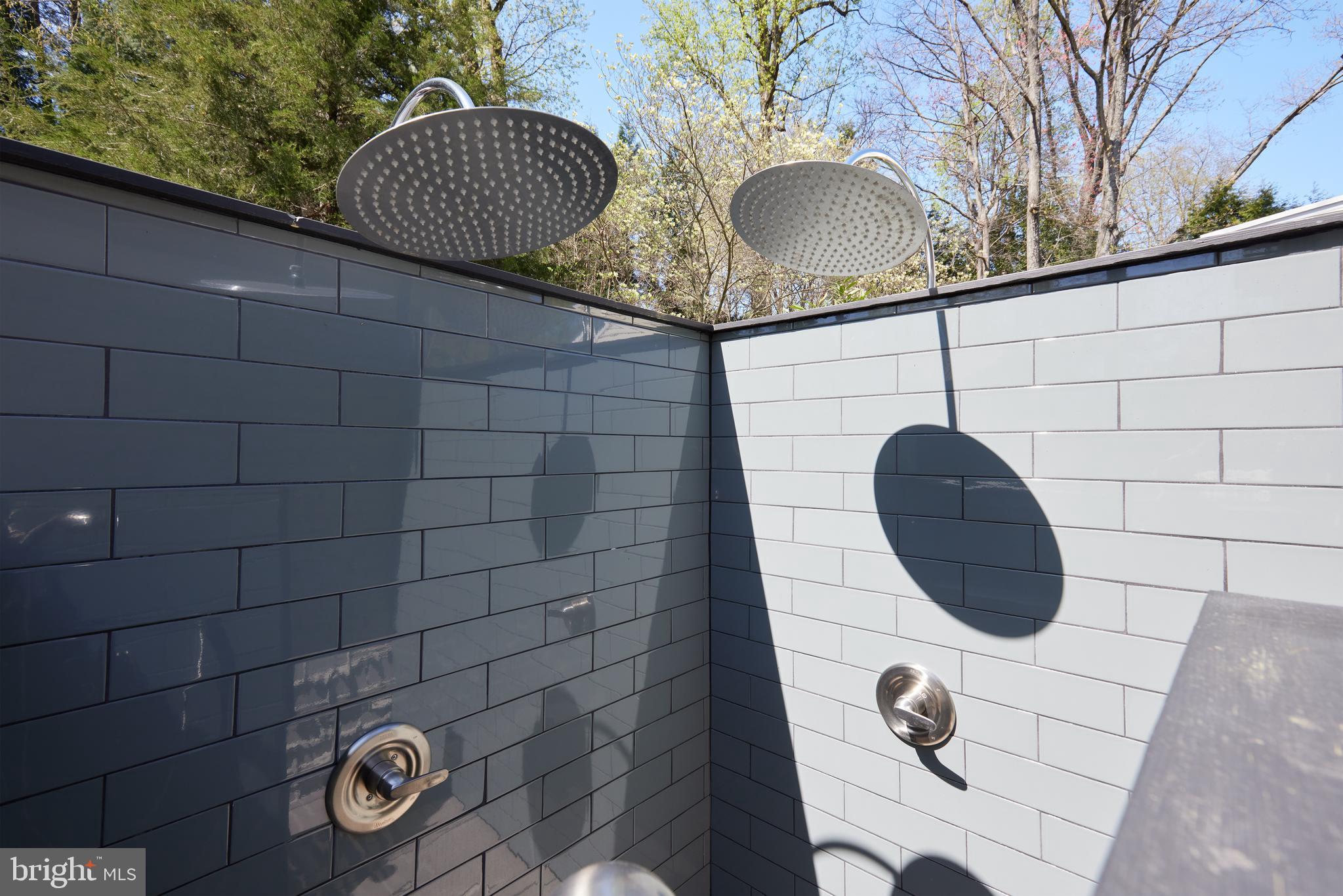 9604 Old Spring Road Kensington, MD 20895 - Photo 57 of 80 a bathroom with a sink and a mirror