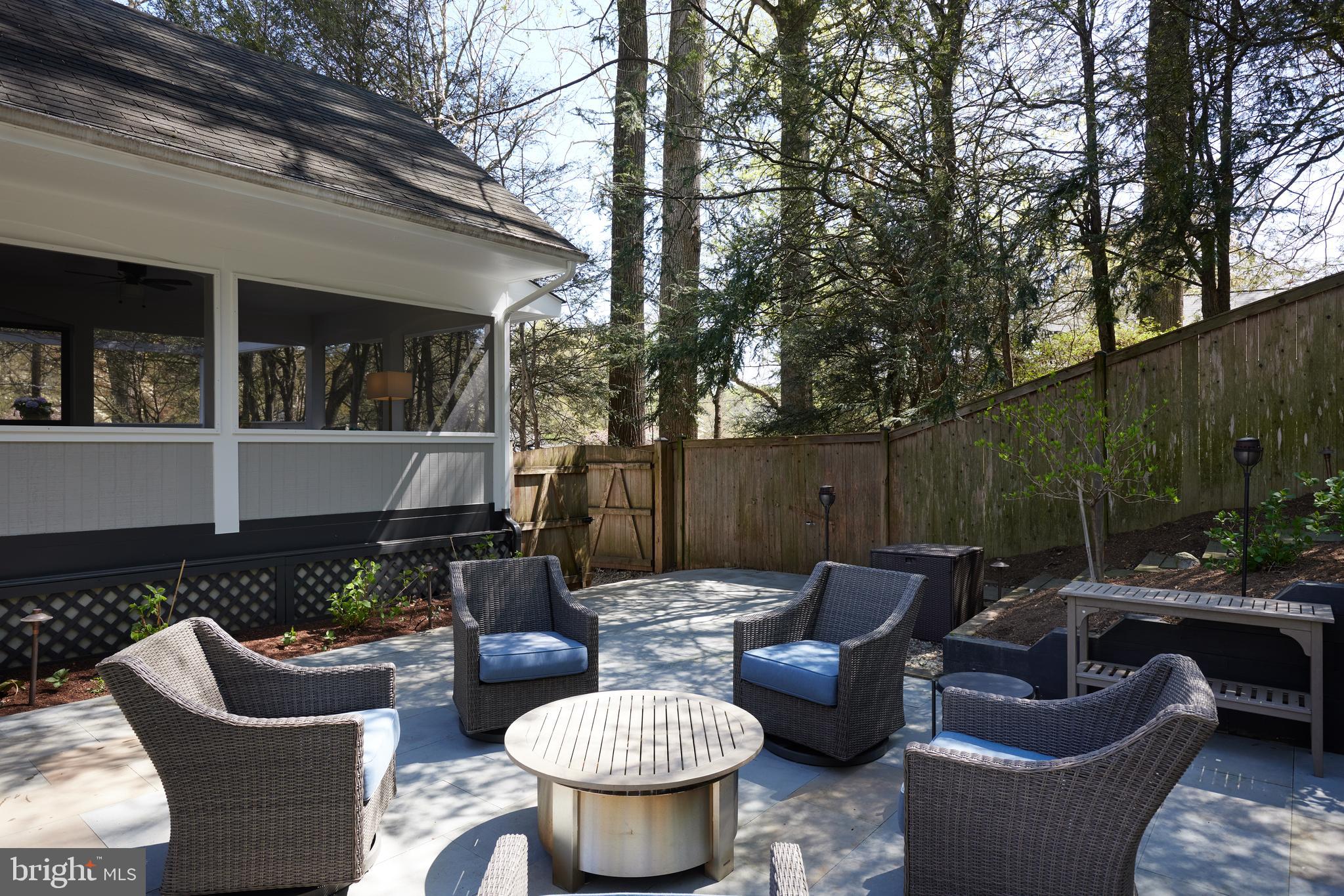 9604 Old Spring Road Kensington, MD 20895 - Photo 60 of 80 a view of a patio with couches chairs and a potted plant