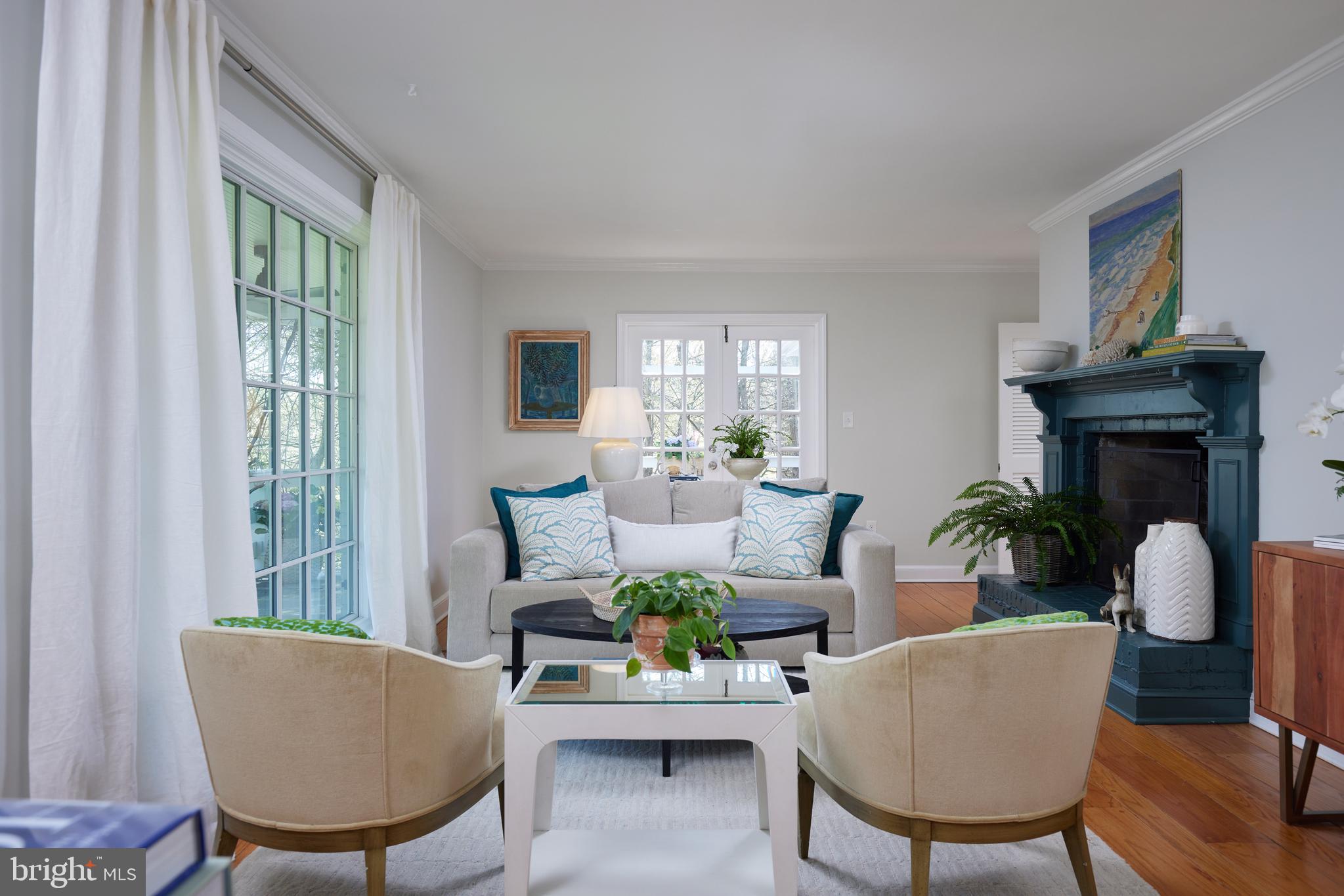 9604 Old Spring Road Kensington, MD 20895 - Photo 7 of 80 a living room with furniture a fireplace and a large window