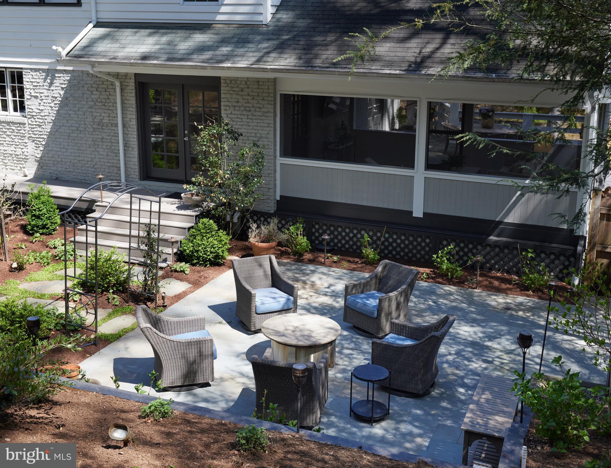 9604 Old Spring Road Kensington, MD 20895 - Photo 75 of 80 a view of a patio with table and chairs potted plants