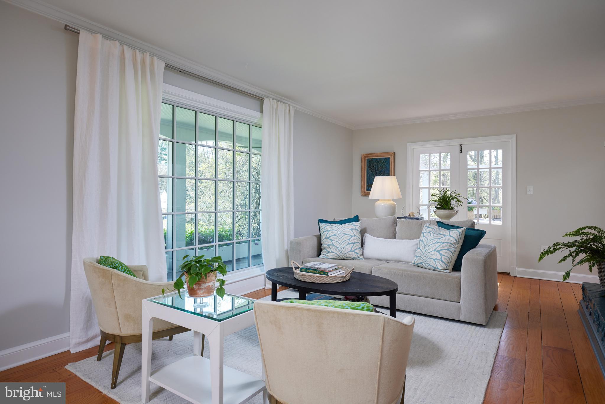 9604 Old Spring Road Kensington, MD 20895 - Photo 8 of 80 a living room with furniture and a potted plant