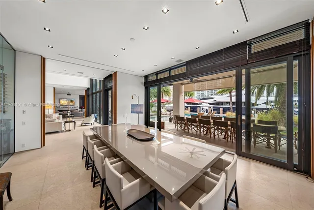 a spacious bedroom with a large bed and a large window