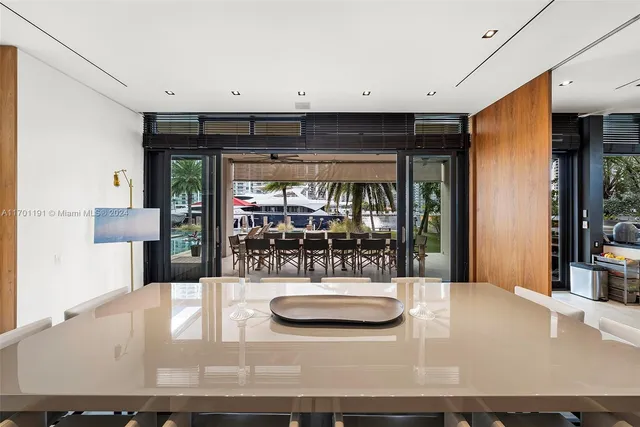 a bedroom with a large bed and a large window