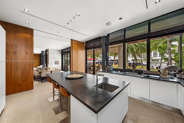 a spacious bedroom with a bed and large windows