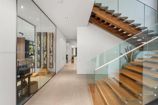 a bathroom with a sink a large mirror and a shower