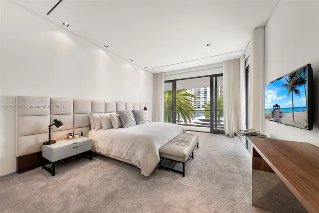 an aerial view of a house with a garden and lake view