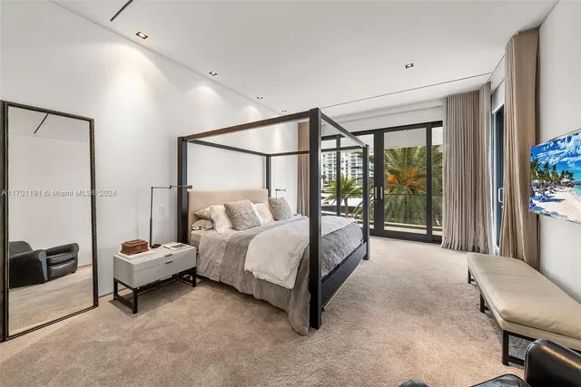 a living room with furniture pool table and chairs