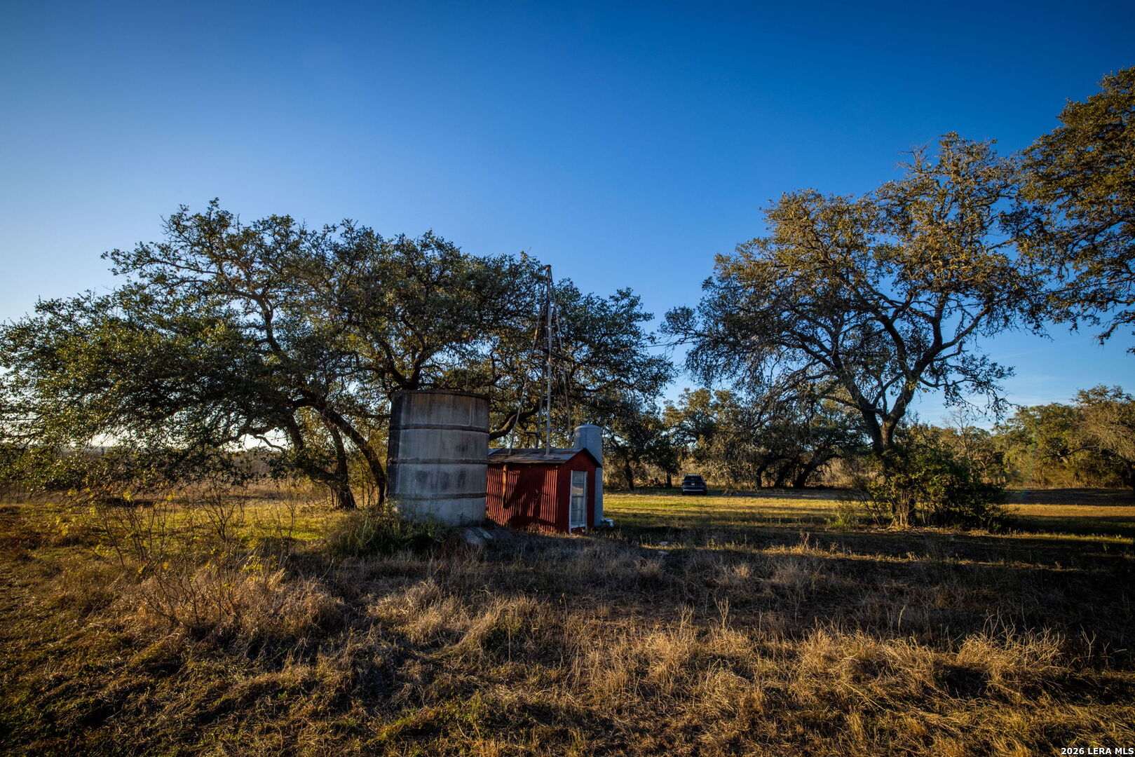 19512 Tonkawa Pass Garden Ridge, TX 78266 - Photo 27 of 67 a view of a lake with houses