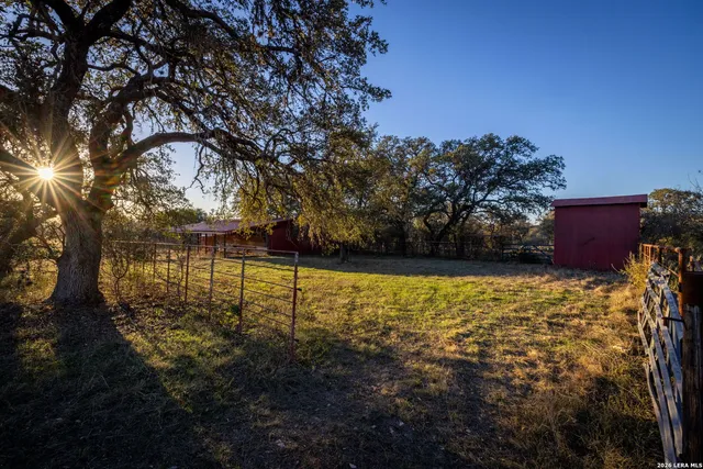 a view of a backyard of the house