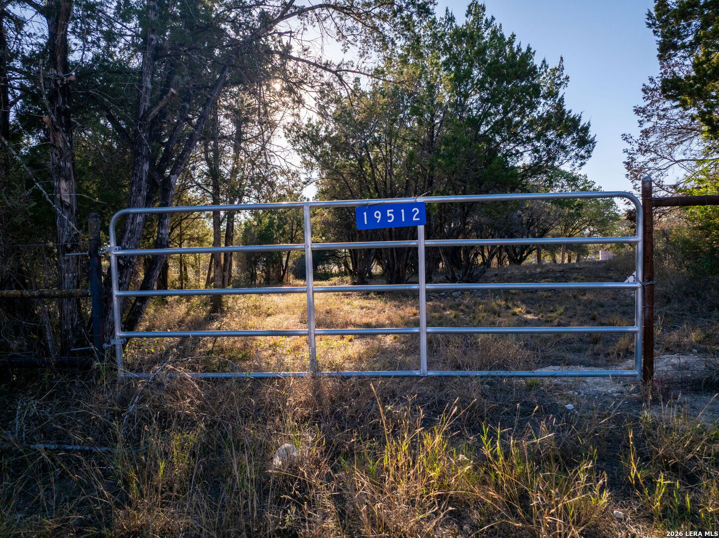 19512 Tonkawa Pass Garden Ridge, TX 78266 - Photo 37 of 67 a view of a swimming pool with an outdoor seating