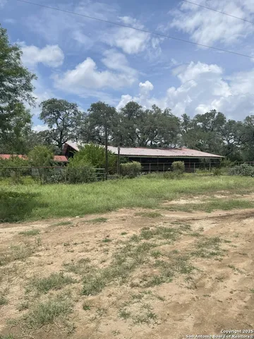 a view of a lake with houses in the back