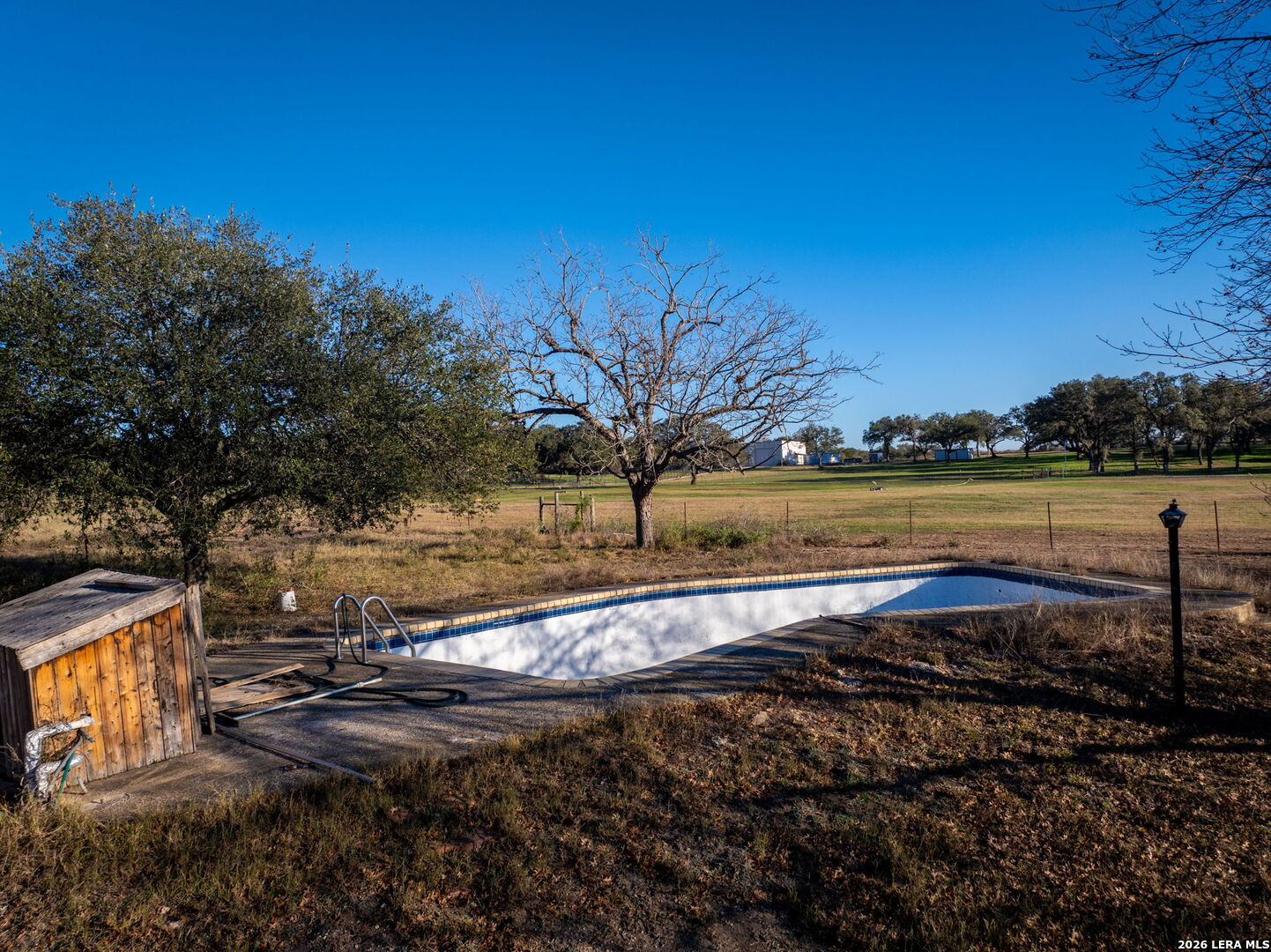 19512 Tonkawa Pass Garden Ridge, TX 78266 - Photo 46 of 67 a view of a lake with a yard
