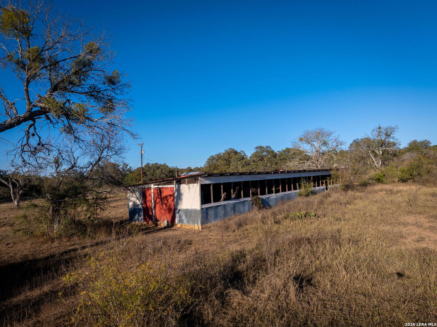 19512 Tonkawa Pass Garden Ridge, TX 78266 - Photo 47 of 67 a view of a house with a yard