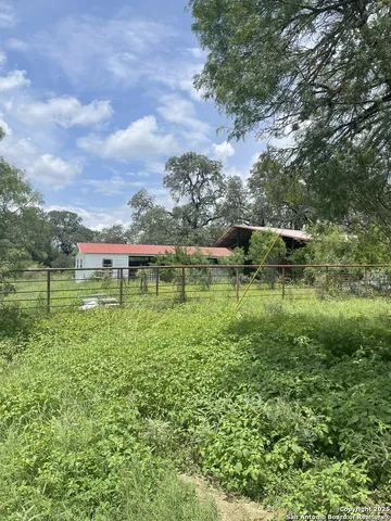 a view of a lake with a yard