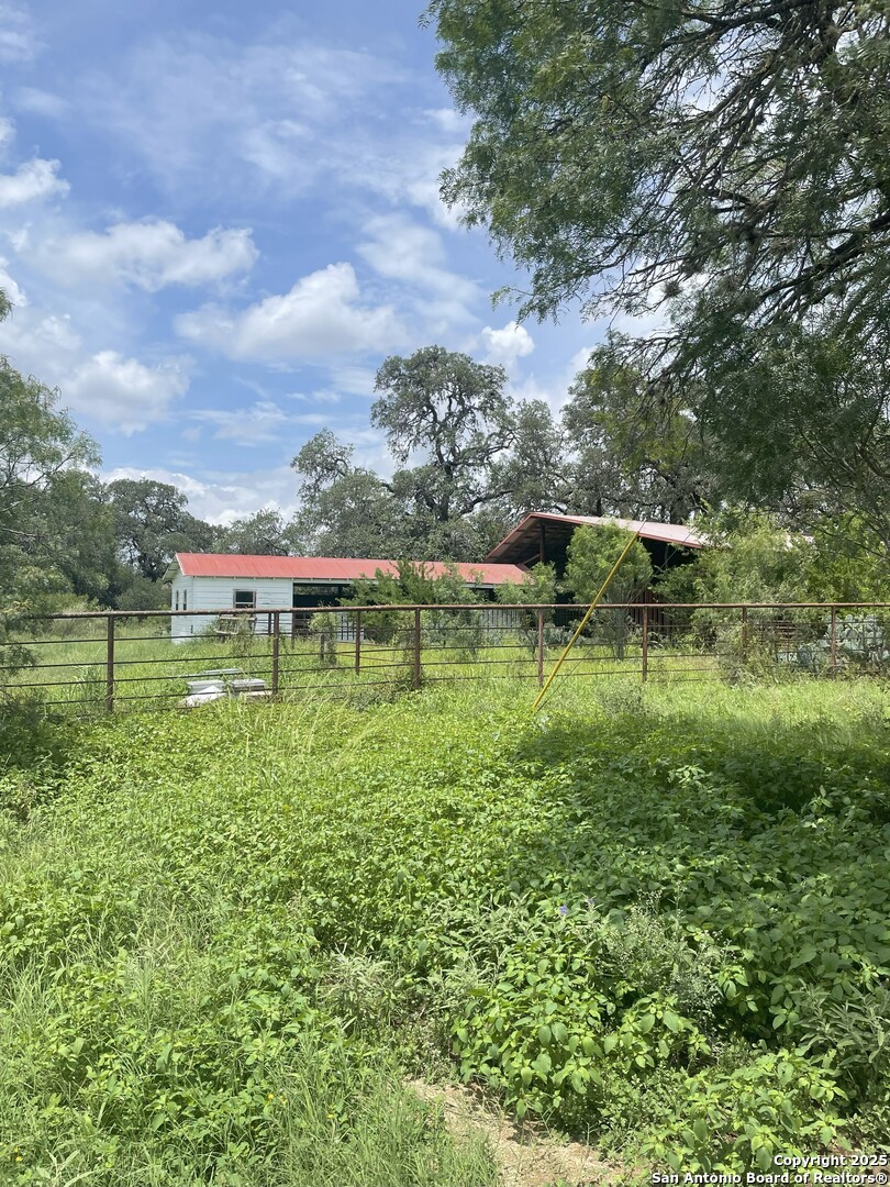 19512 Tonkawa Pass Garden Ridge, TX 78266 - Photo 5 of 6 a view of a lake with a yard