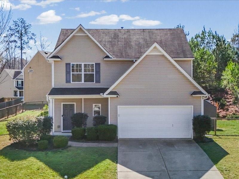 front view of a house with a yard