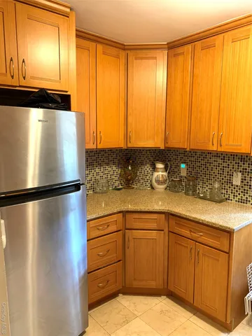 a kitchen with stainless steel appliances a refrigerator and a sink